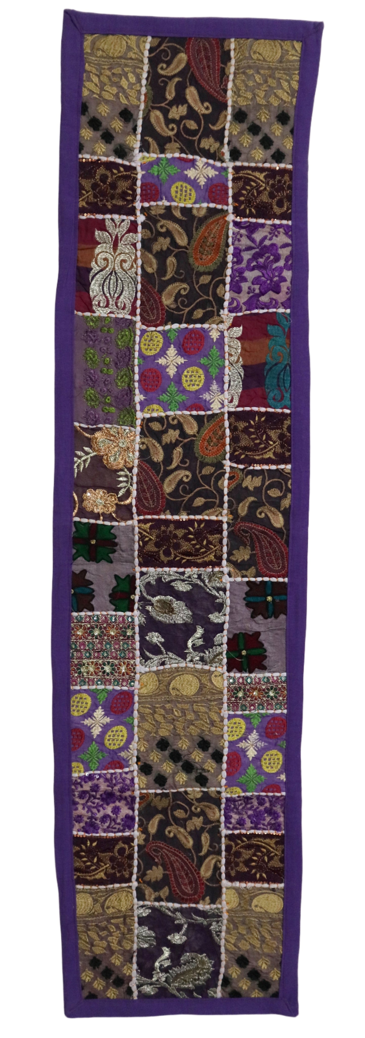 Patchwork fabric with various patterns and colors on a white background