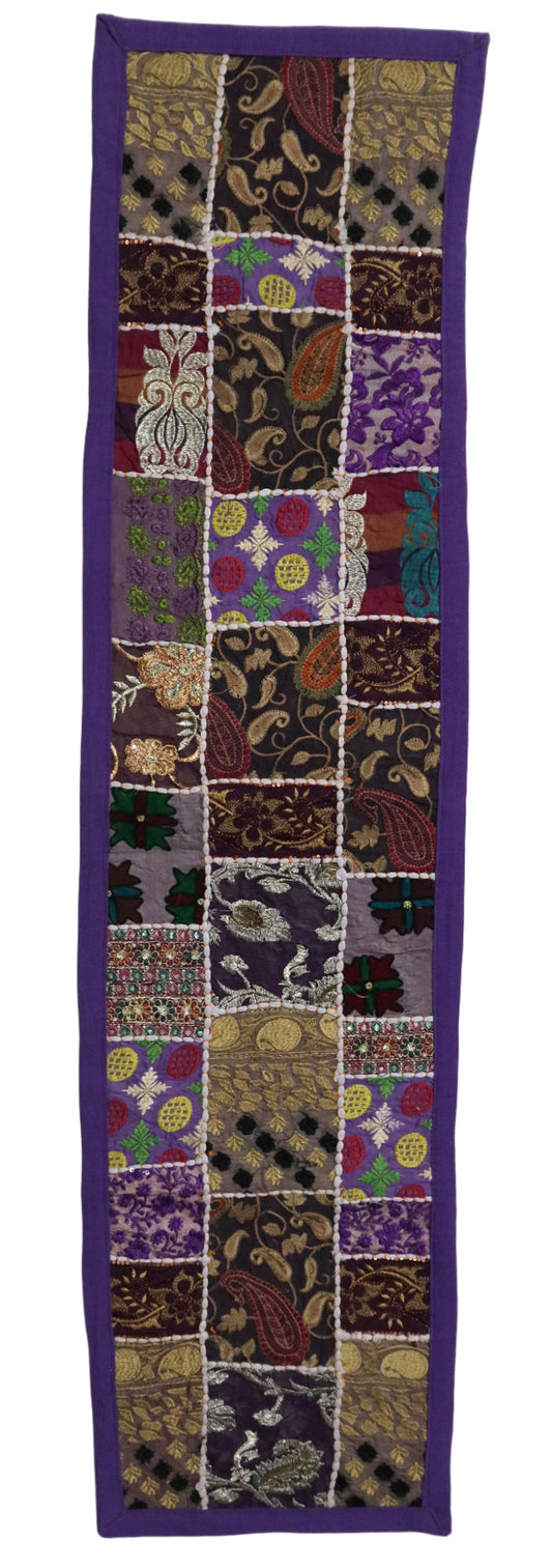 Patchwork fabric with various patterns and colors on a white background