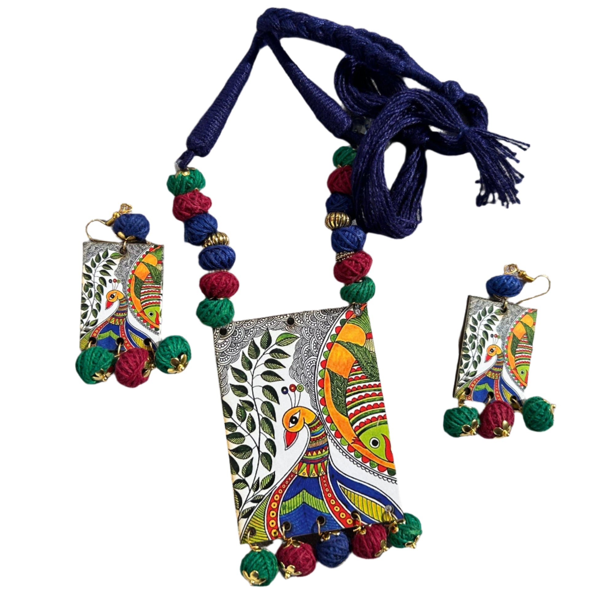Colorful necklace and earrings set on a gray surface