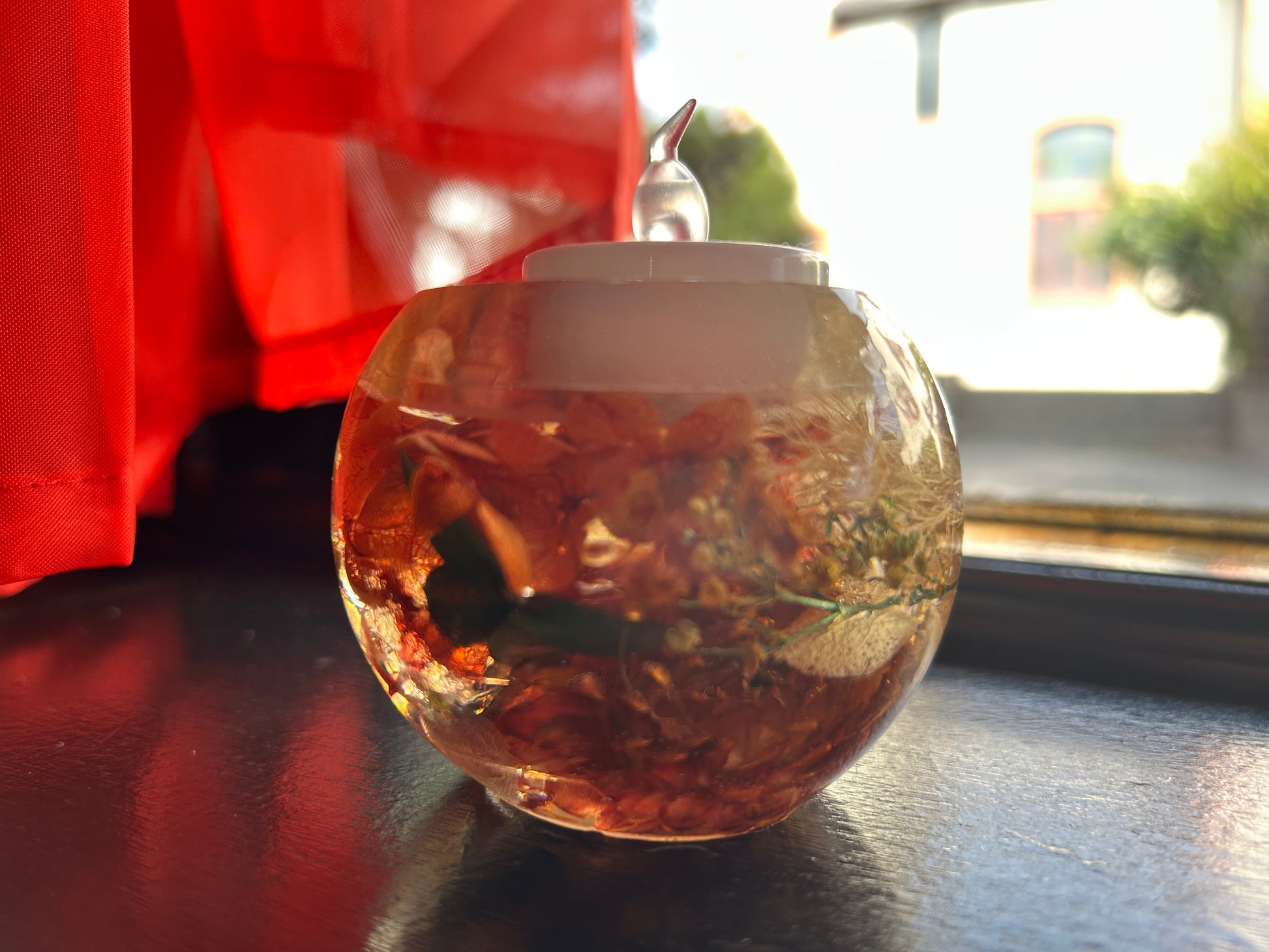 Resin with a candle on a dark surface, blurred background