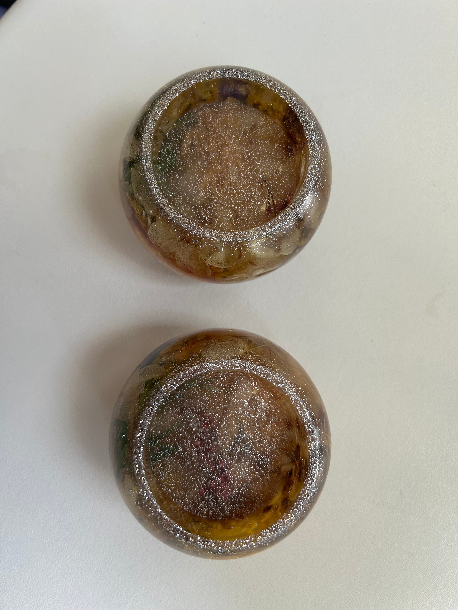 Two brown ceramic bowls with a textured surface on a white background