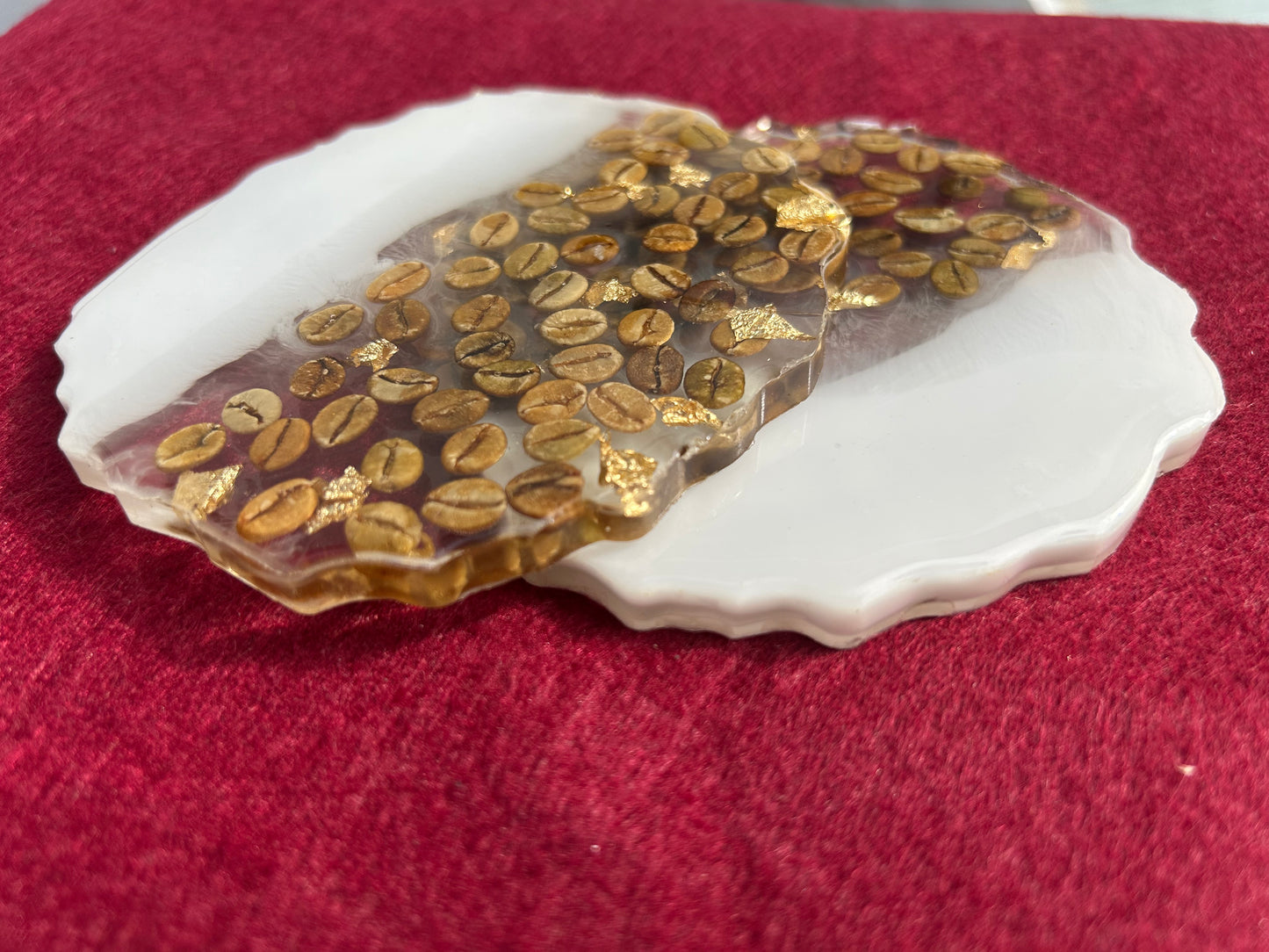 Shell with embedded gold coins on a red background