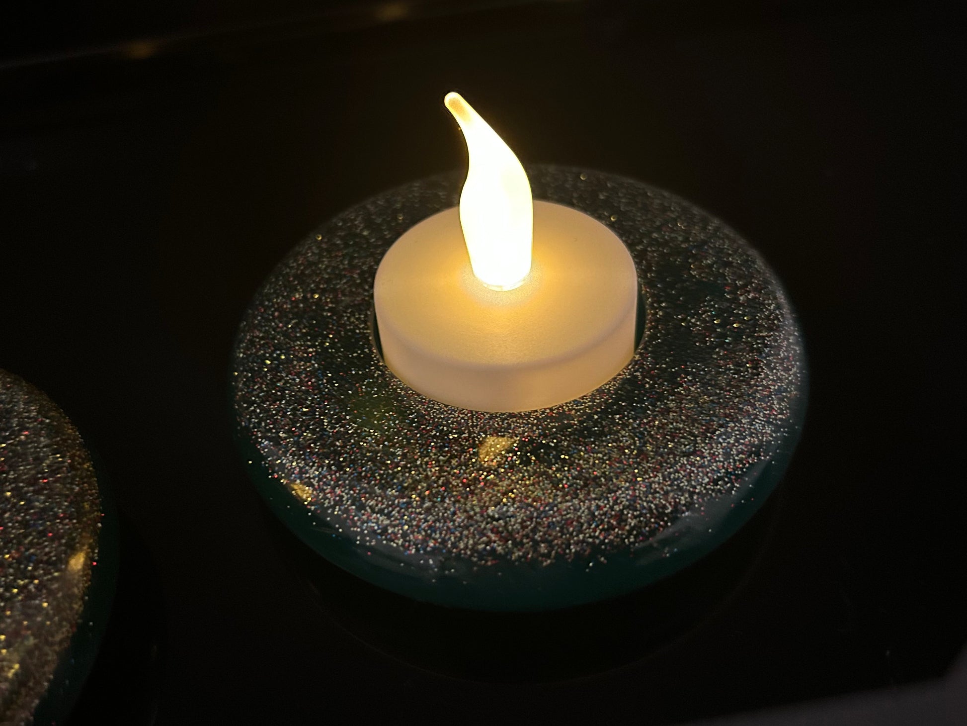 Floating candle on a dark background