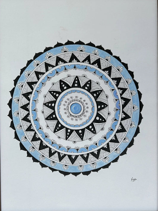 Framed mandala art with concentric circles on a white background